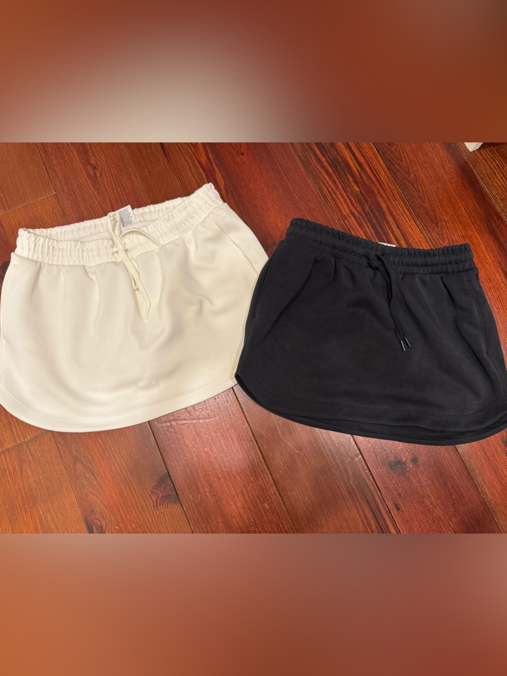 NWOT All in Motion - tennis skirts with built in shorts. White sz M, Black sz S